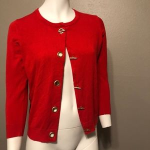 Bright red cardigan with unique grommet closures!